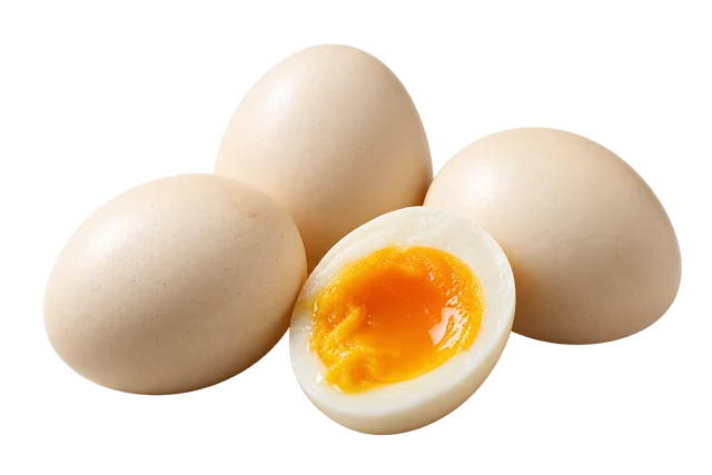 Whole eggs and an egg half, illustrating the food rather than an exact cooked portion